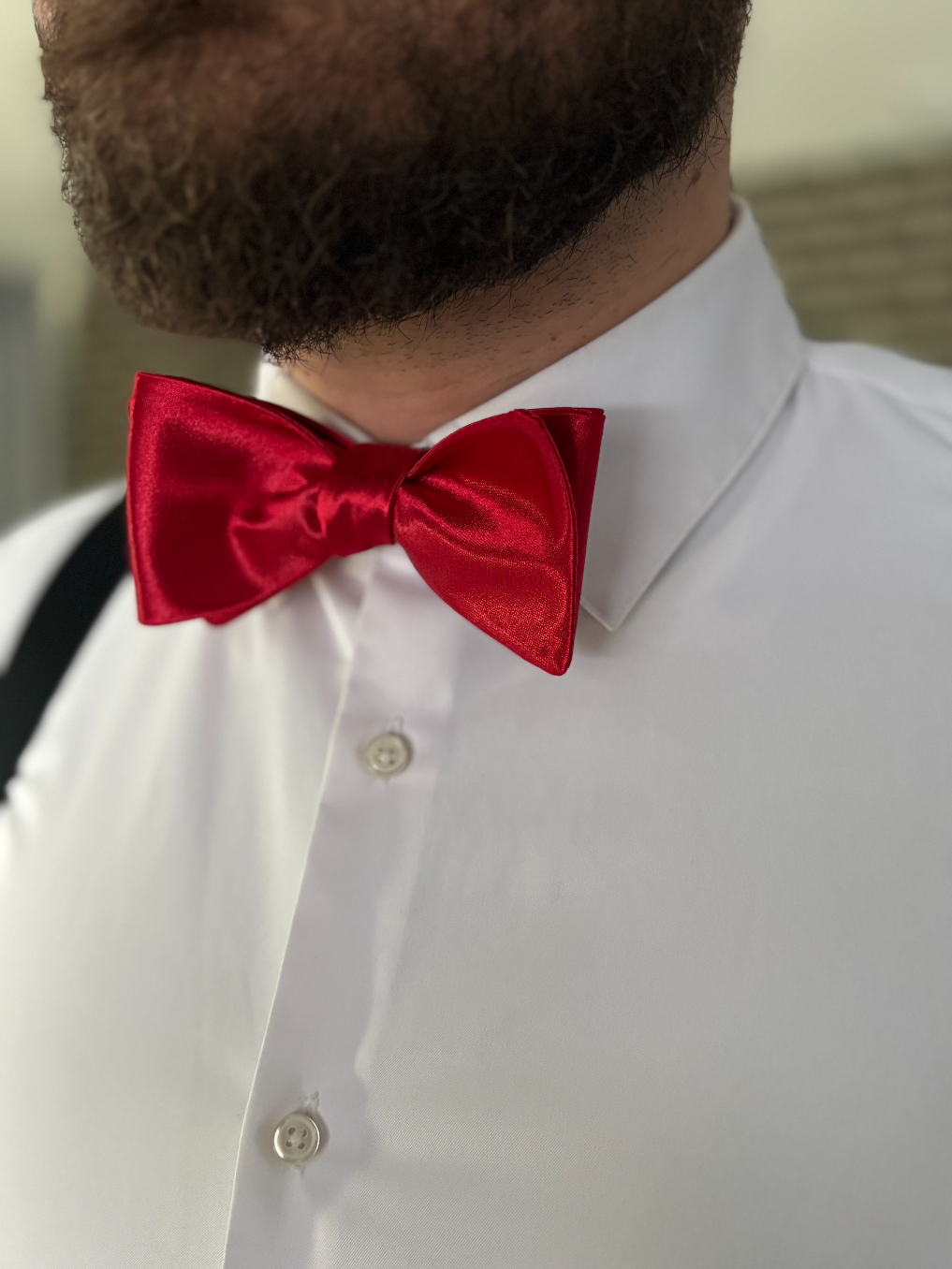 Glossy red self-tie bow tie