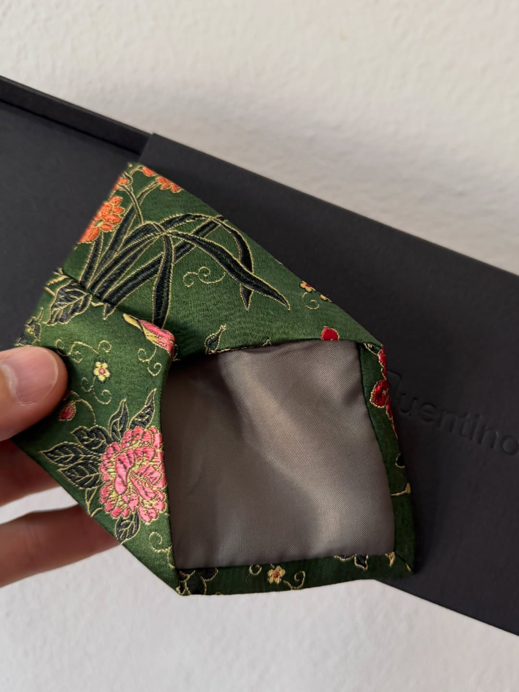 Repaired silk tie inherited from grandfather, close-up of repaired seams